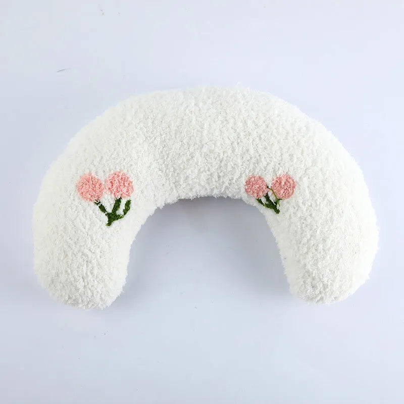 Soft quilted U-shaped cat pillow in blue, 26x18cm, on a clean white background