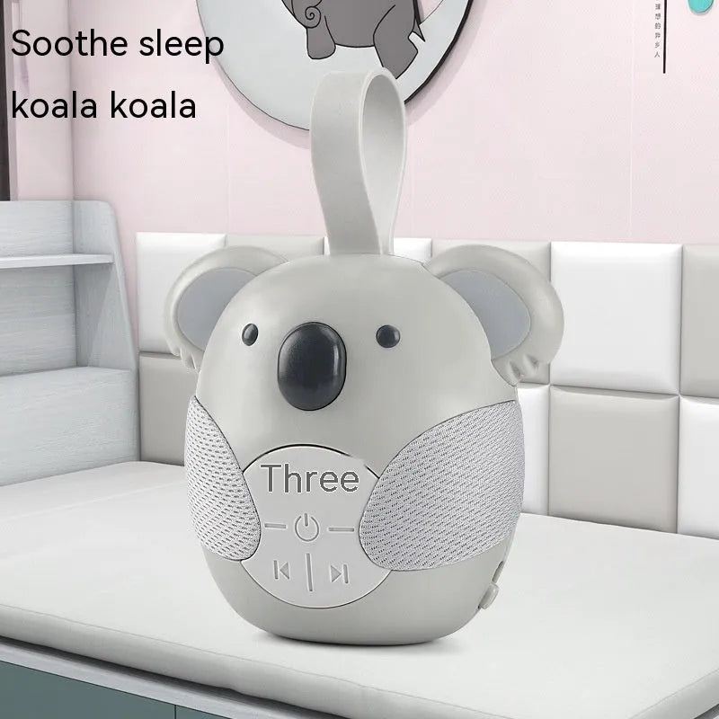 Koala-shaped infant white noise player toy in fox colour on a surface