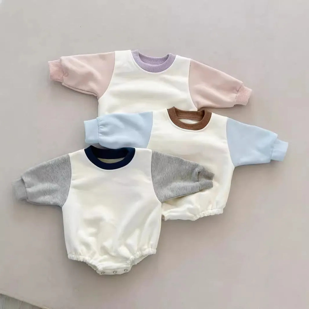 Baby romper in cotton triangle jumpsuit style with hidden hook closure, autumn weight, available in multiple colours