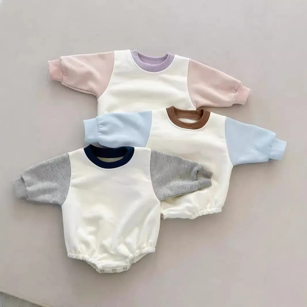 Baby romper in cotton triangle jumpsuit style with hidden hook closure, autumn weight, available in multiple colours