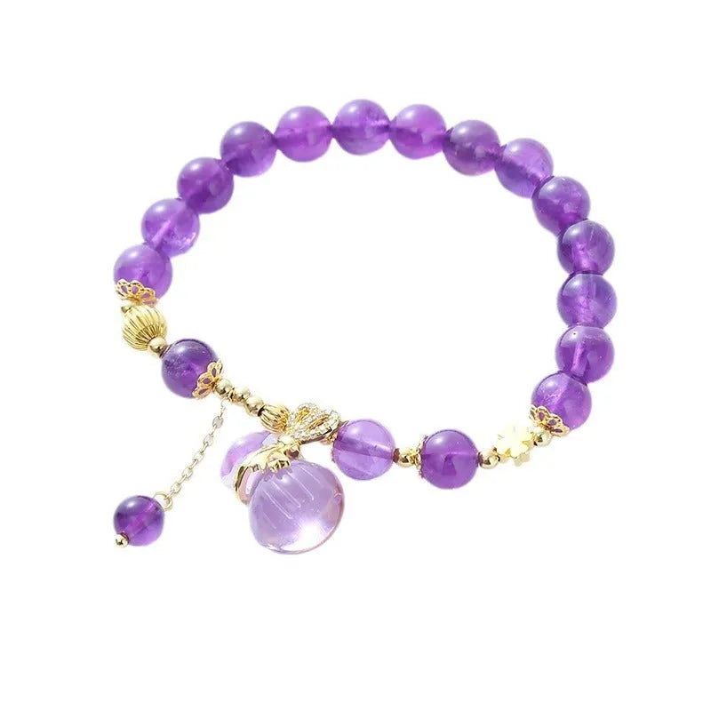 Purple amethyst crystal bracelet with ethnic money bag pendant and peace buckle closure