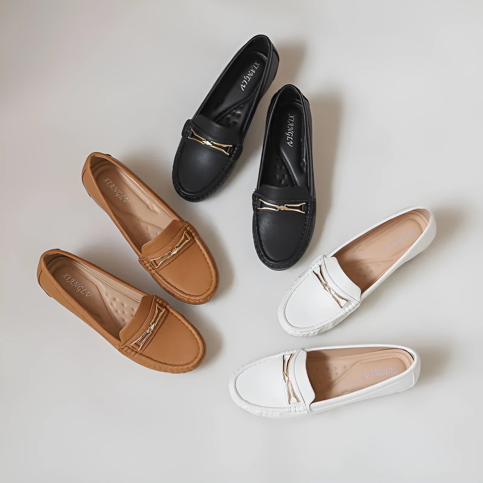 Men's black casual slip-on loafers with a built-in heel lift and round toe.
