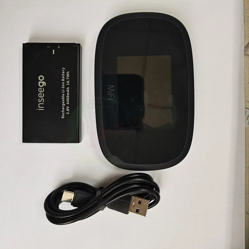 Black mifi8000 4G portable WiFi router with removable battery on a table