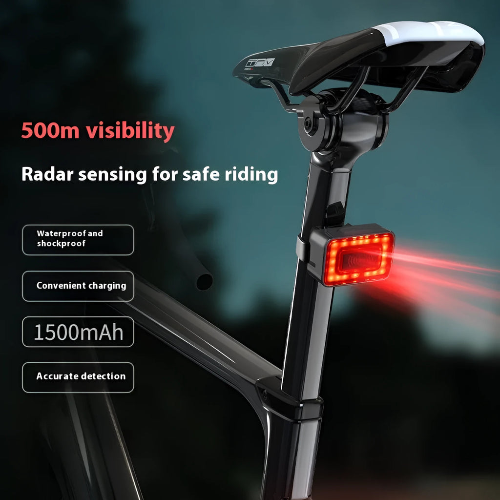 Compact black radar bicycle tail light with dual buttons mounted on a bike seat post