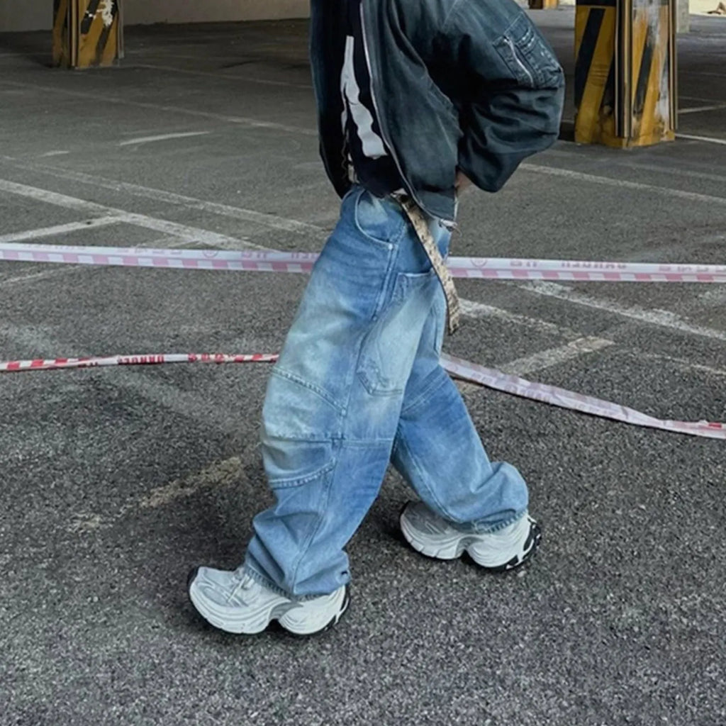 Men's washed blue baggy jeans with pleated front detail and straight-leg cut
