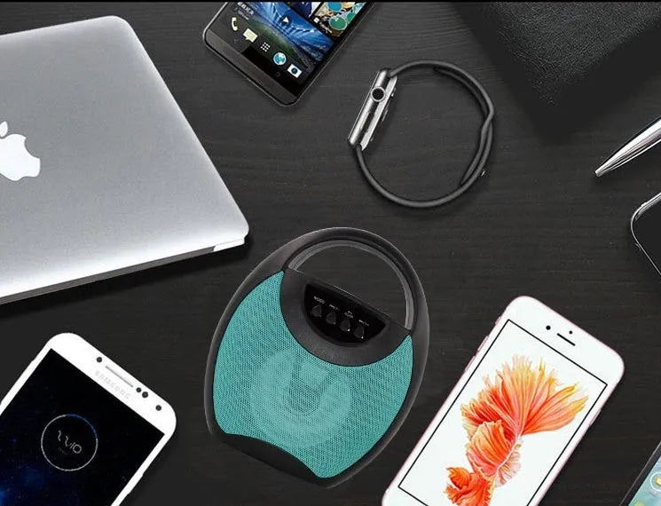 A portable Bluetooth speaker in black, blue, or pink plastic casing with USB and SD card slots.