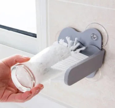 Grey double-head rotating cup brush with suction cups for wall mounting
