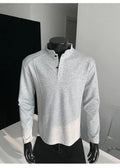 Men's loose-fitting patchwork stand-up collar long sleeve polo shirt in heather gray.