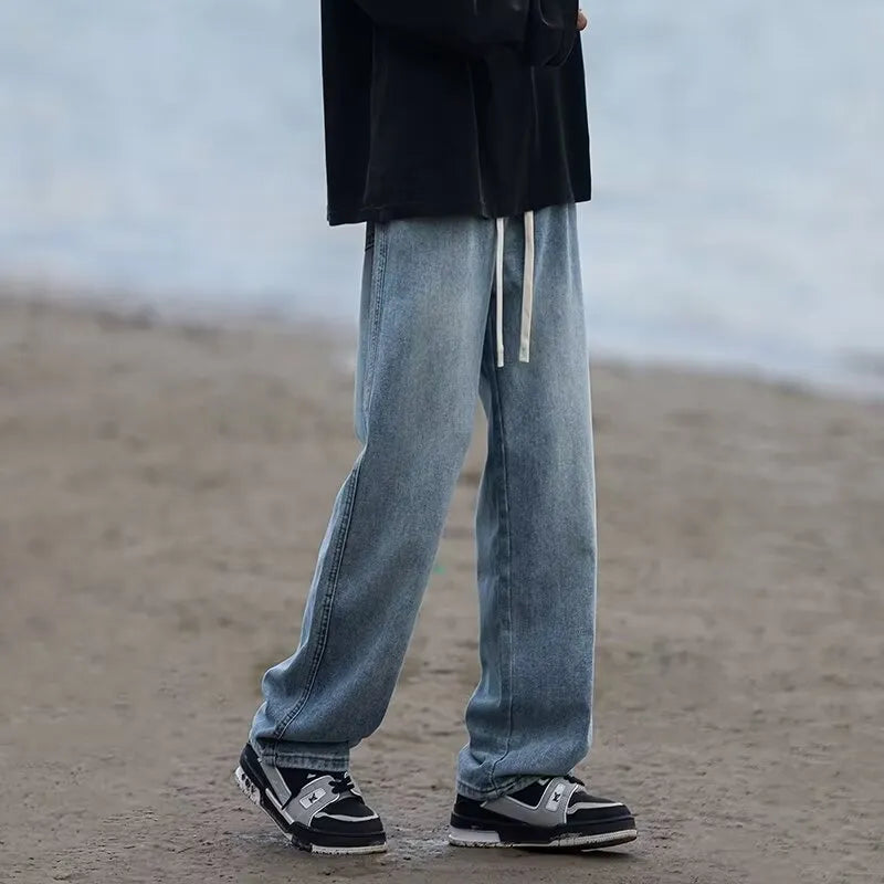 Men's straight-leg blue jeans with drawstring waist on mid-waist cut