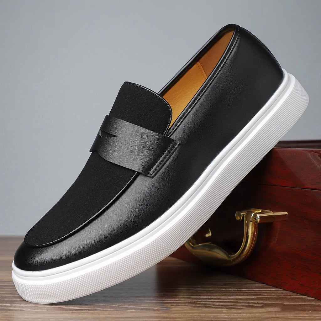 Black men's slip-on casual shoes with tassel detailing and a round toe