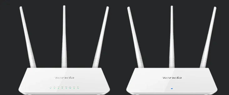 White Asus RT-AX57 Go WiFi 6 router with multiple antennas on a wooden desk