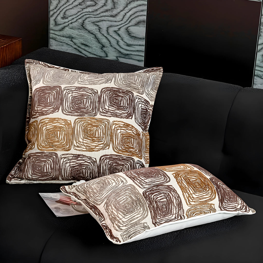 Cream and coffee coloured abstract coil pattern pillow cover in square and lumbar sizes.