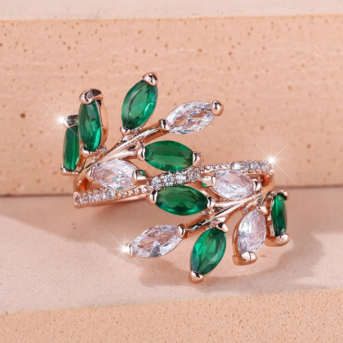 Adjustable copper leaf-shaped ring with a central horse eye zircon stone, shown in a rose gold finish.