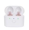Beige rechargeable behind-the-ear hearing aid with magnetic charging dock and portable case.