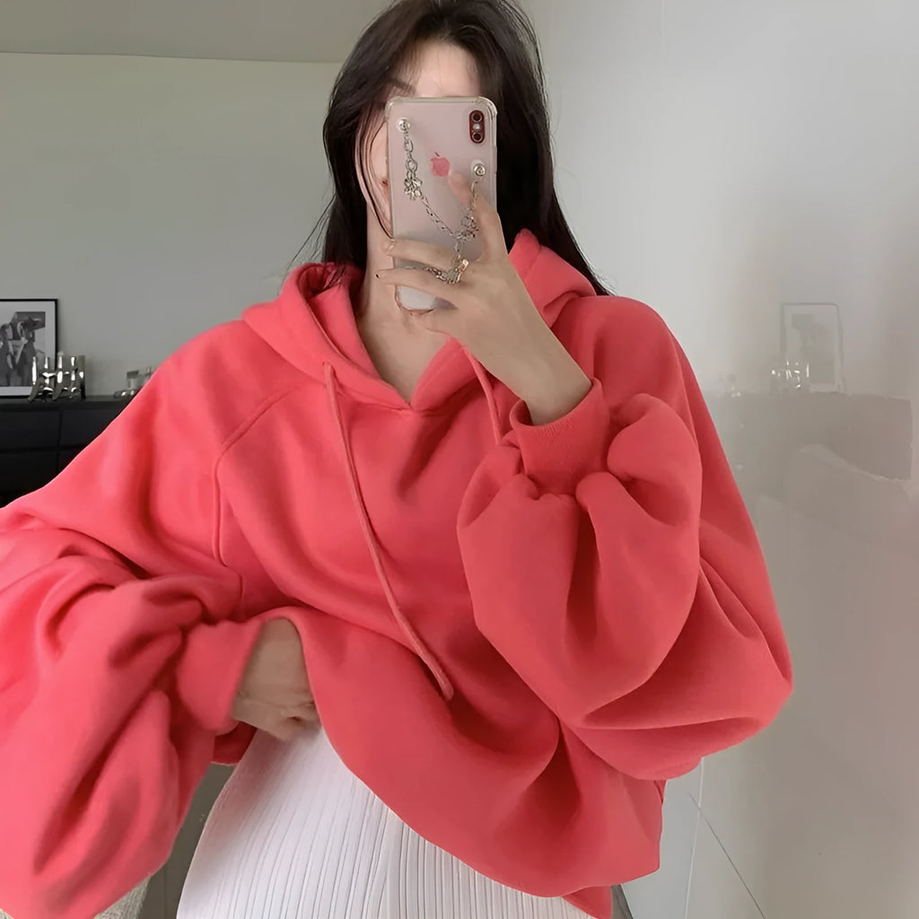 Watermelon red mulberry silk women's hooded sweater in loose pullover style.