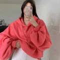 Watermelon red mulberry silk women's hooded sweater in loose pullover style.