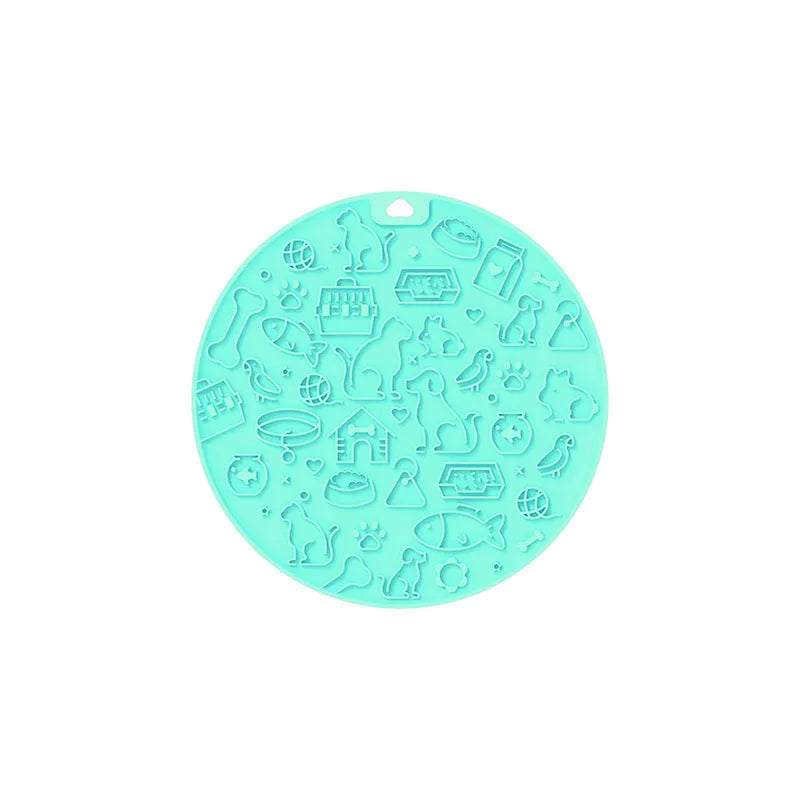 Round silicone pet licking mat with suction cups on a flat surface.