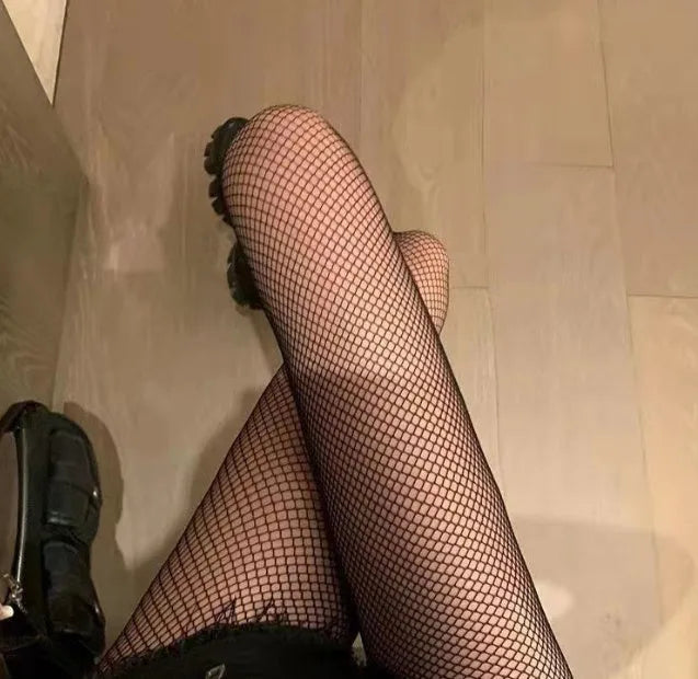 Women's black and white mesh stockings showing large, medium, and small net patterns in thin velvet polyester fabric.