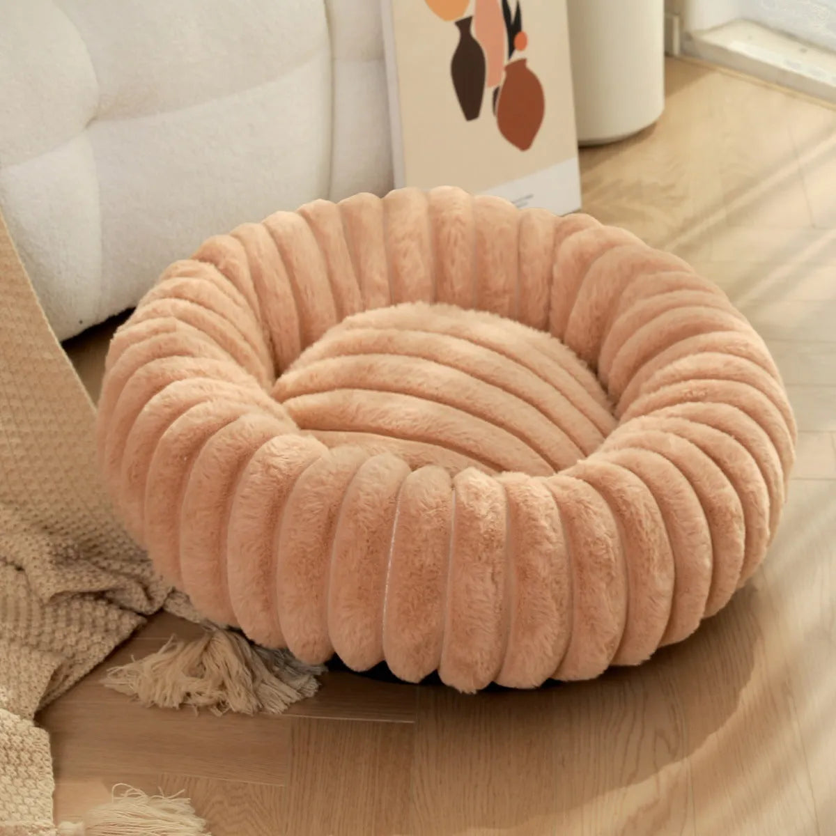 Round plush pet bed with long-hair rabbit fur style texture in beige colour