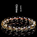 Original design natural citrine scattered beads ball bracelet showing polished yellow stones in a textured arrangement.