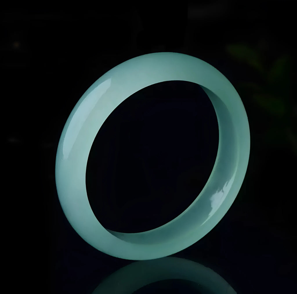 Oil cyan light green jade bracelet in modern simplicity style on wrist