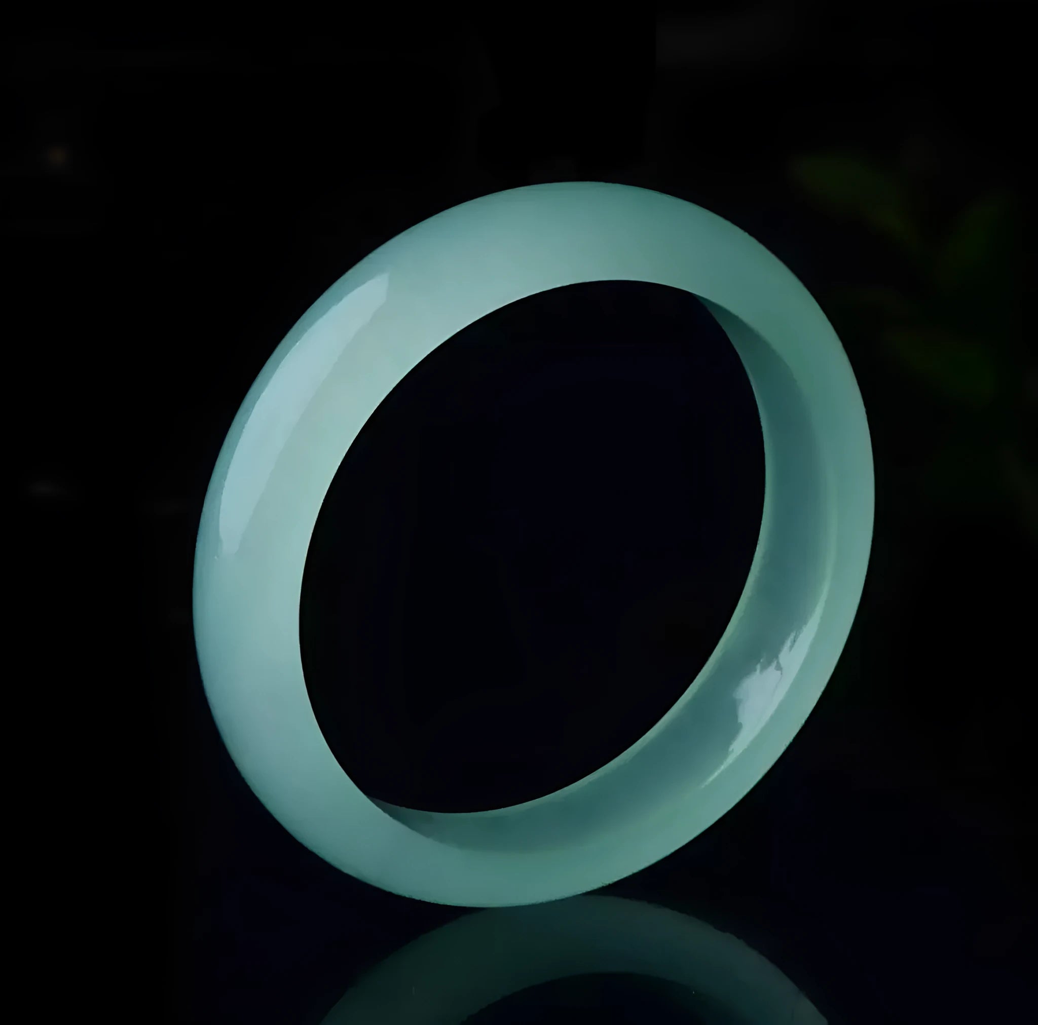 Oil cyan light green jade bracelet in modern simplicity style on wrist