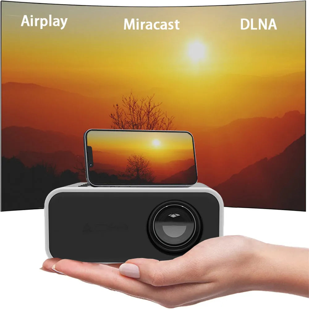 Black or white YT300 portable mini HD projector with remote control on a table.