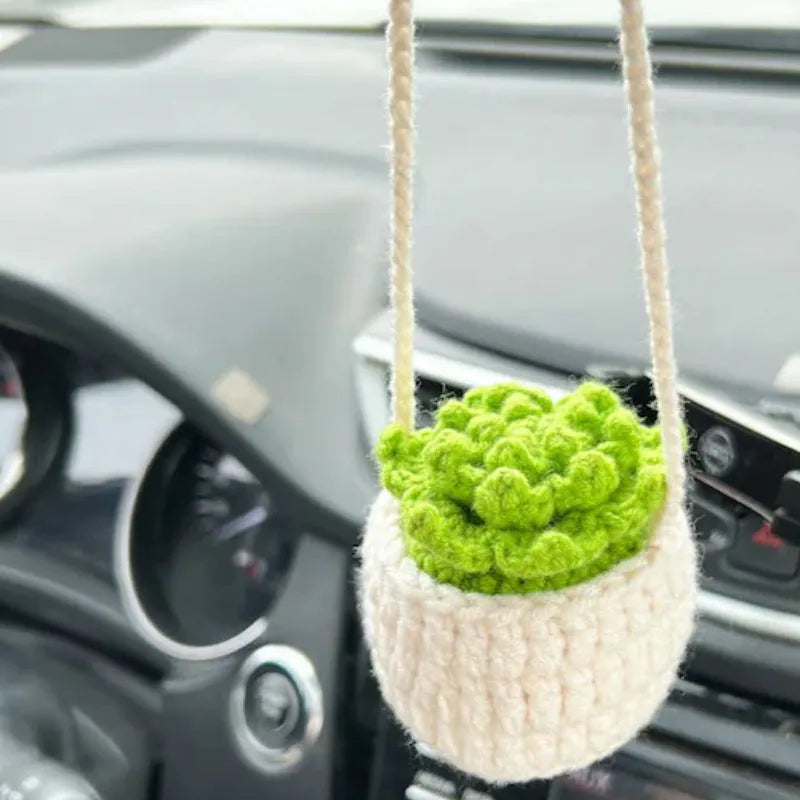 Green and white knitted wool car plant decoration with basin base and hanging rope