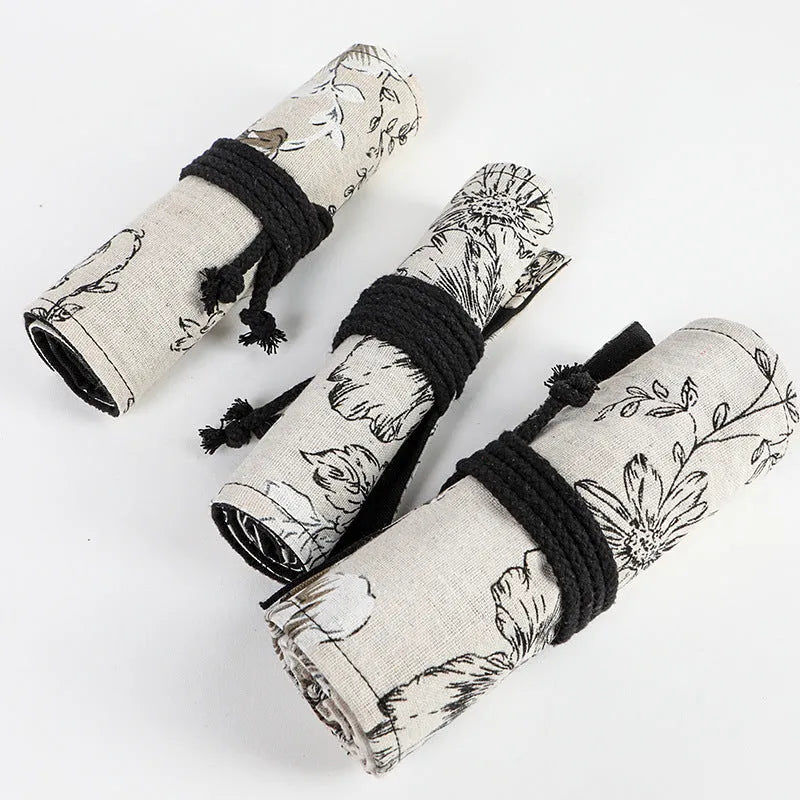 Black Peony floral print cotton hemp pencil roll bag, shown open with 24 holes.