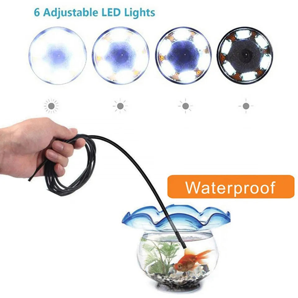 USB-C endoscope with camera head, flexible cable, and hook, magnet, and mirror attachments on a table.