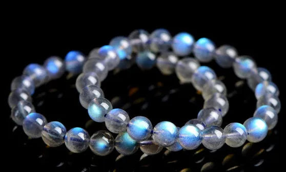 Natural cream body blue moonlight crystal bracelet showing minimalist design on wrist.