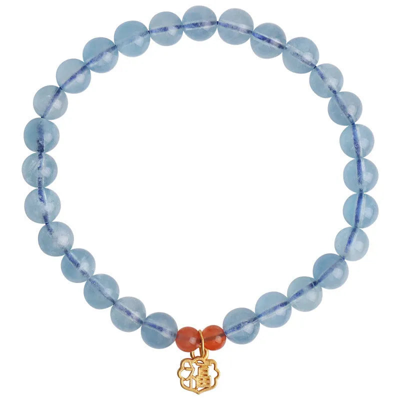Icy translucent aquamarine crystal bead bracelet with sequin charm and blessing card.
