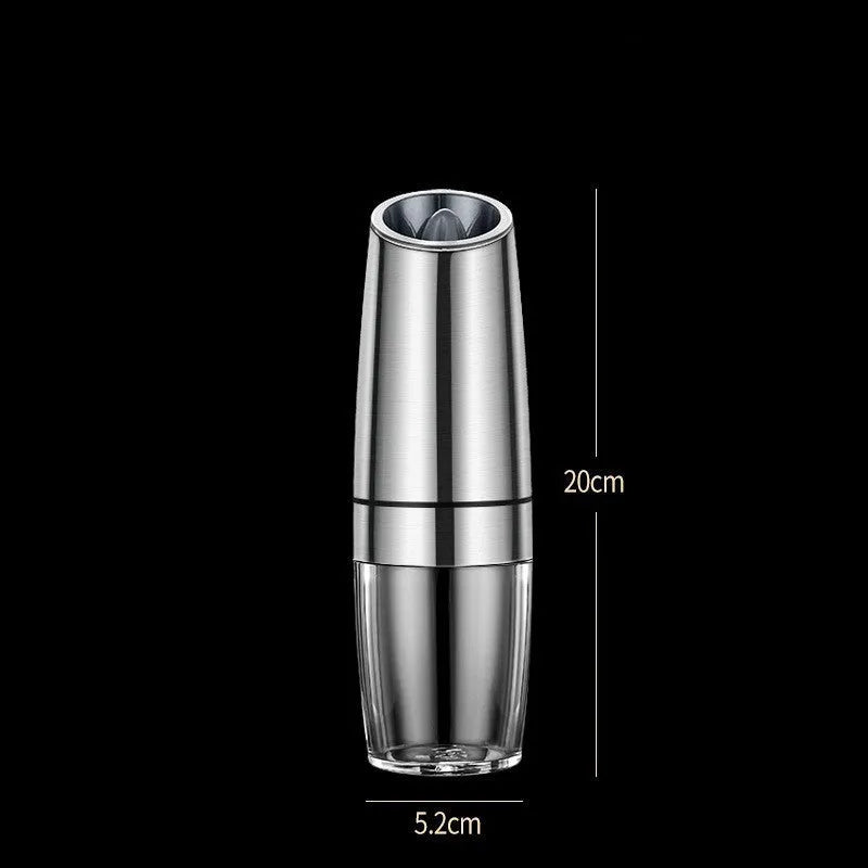 Black and silver electric pepper and salt grinder set with clear acrylic body on a kitchen counter.