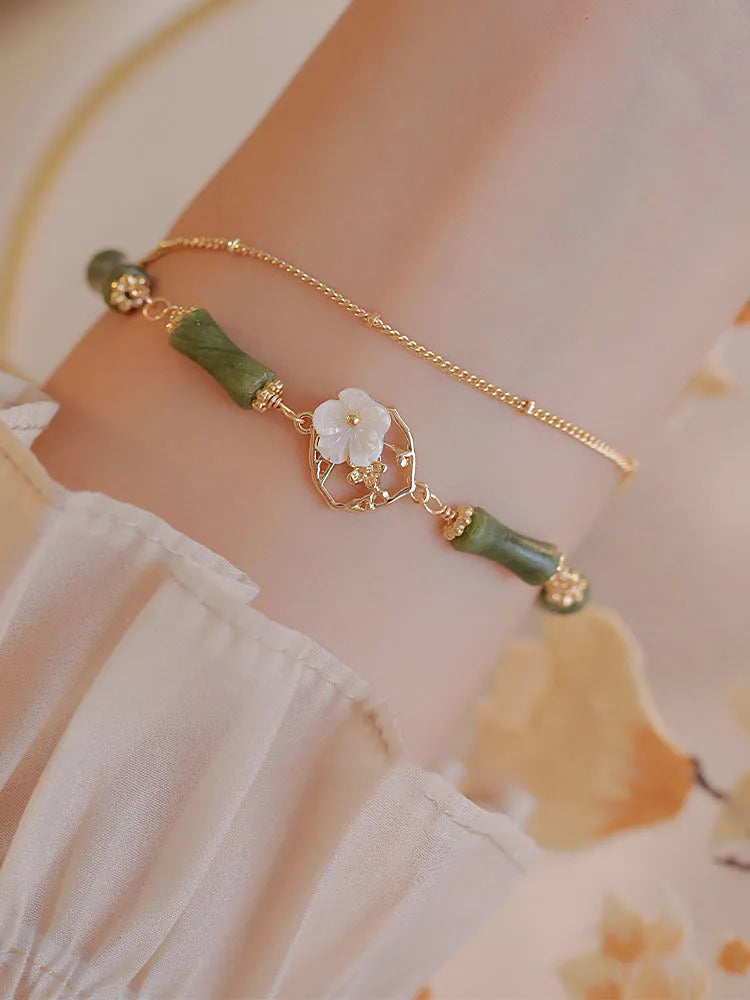 Natural olivine double layer bracelet with twin bells of Ireland charms and olive branch elements