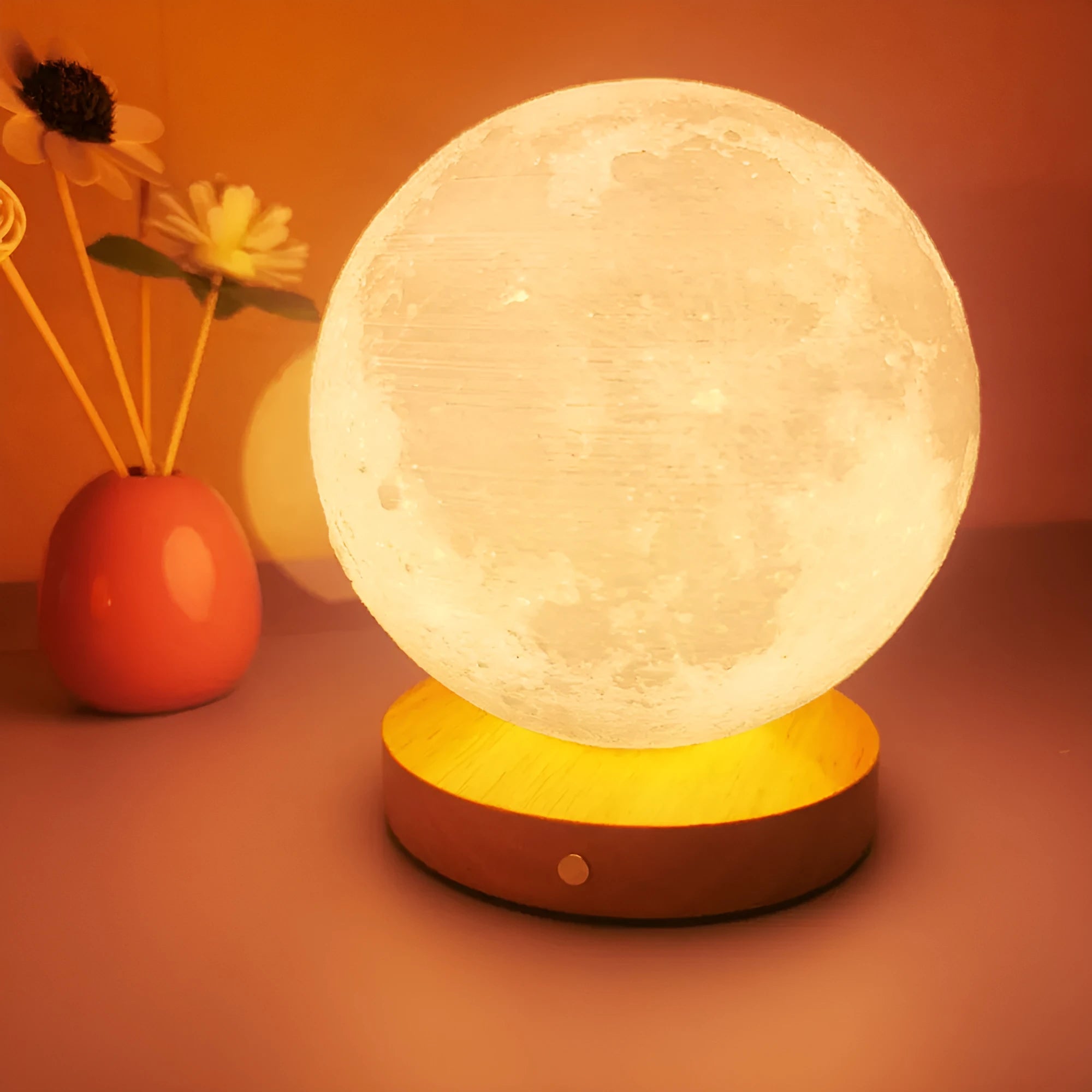 Rotating sleeping moon night lamp with wooden base showing three colour settings