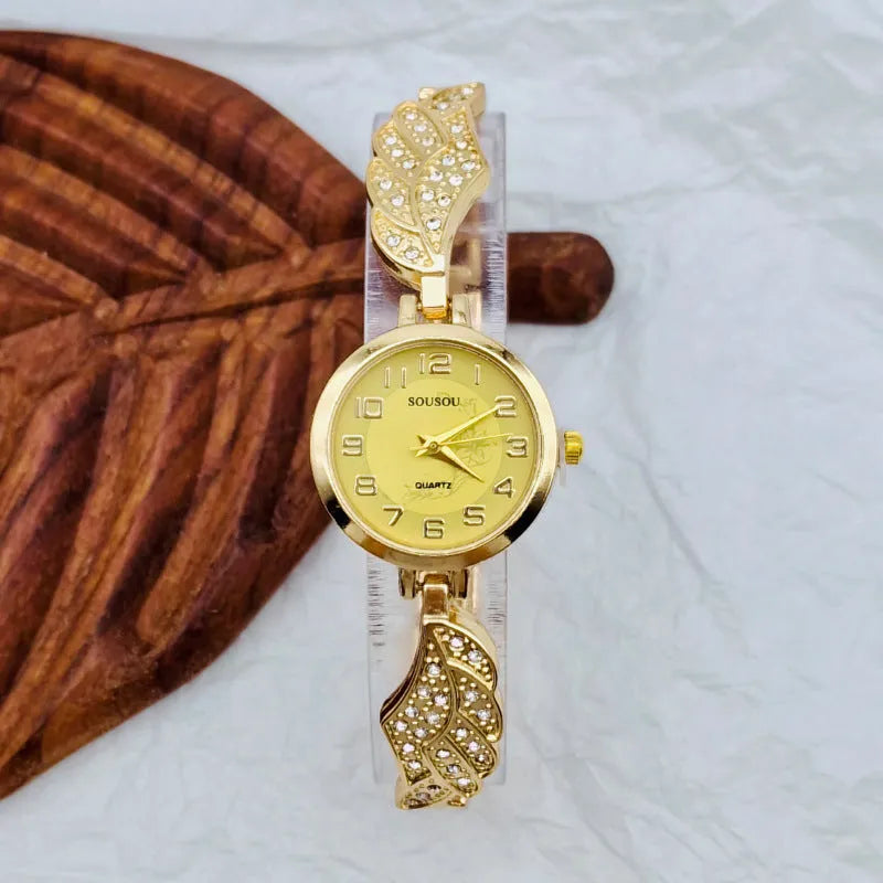 Stainless steel women's watch with round dial showing gold face colour option and vachette clasp buckle