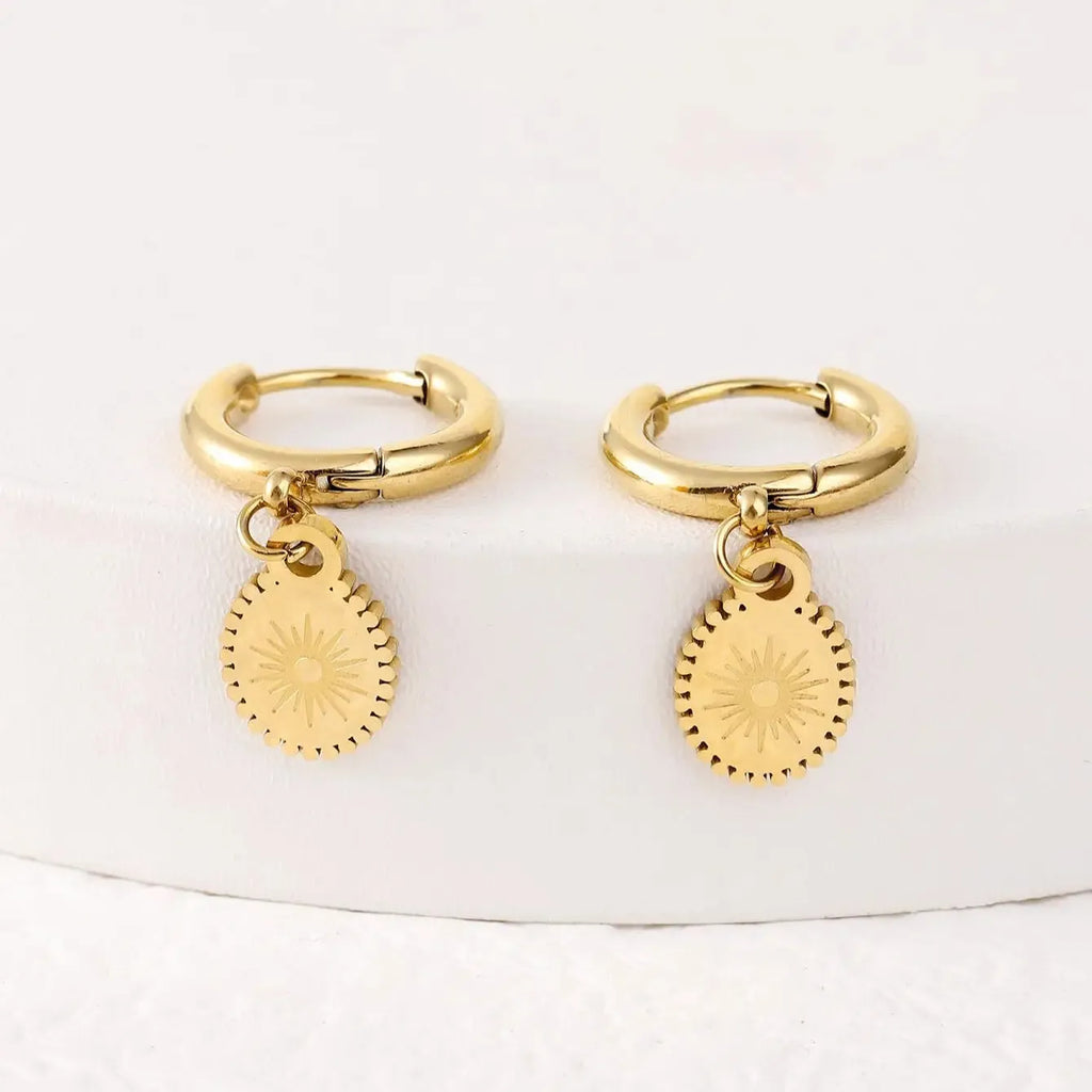 A pair of stainless steel geometric ellipse earrings in colour XY-EH005 on a white background.