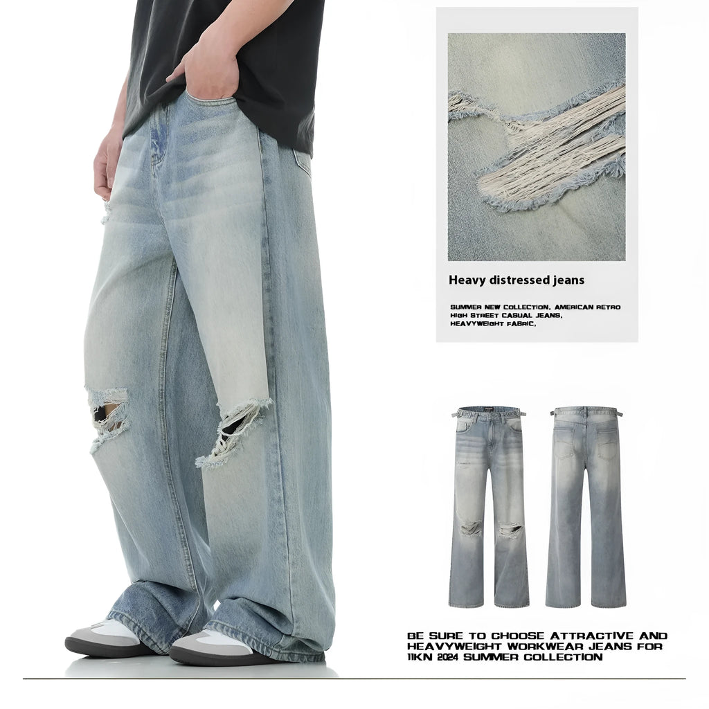 Blue men's straight-leg jeans with ripped details and a zip fly on a neutral background.
