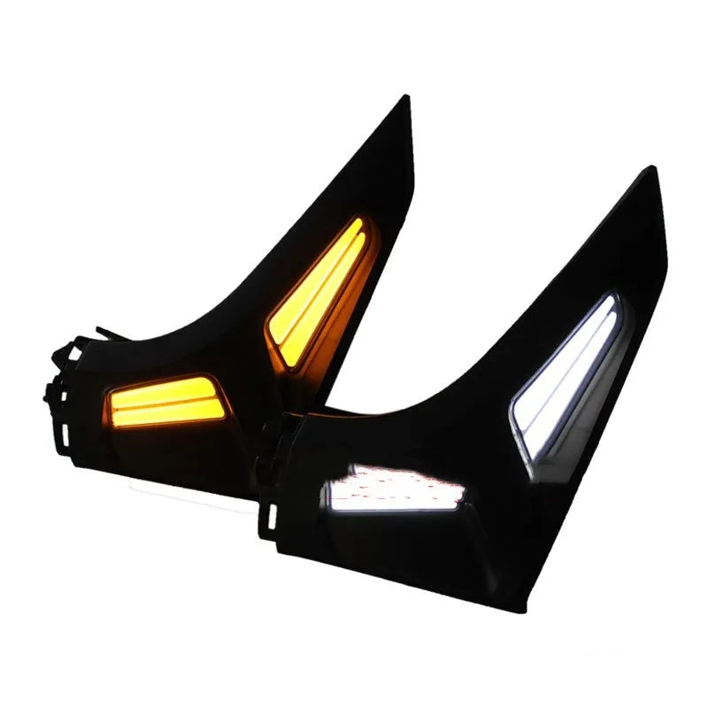 Pair of white and yellow LED turn signal lights mounted on a Yamaha NMAX155 scooter's steering column