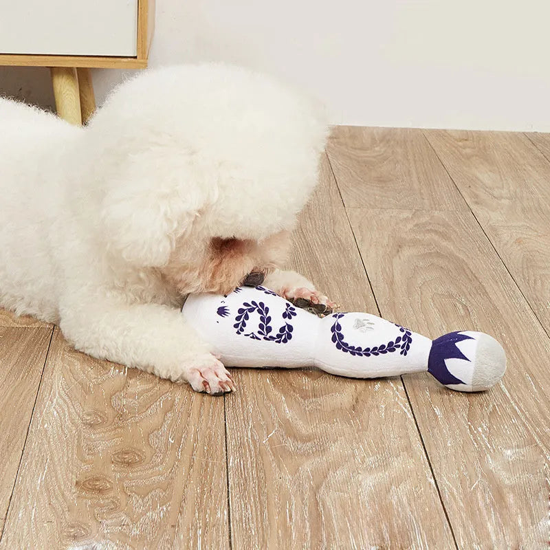 Red and white tequila bottle plush dog toy with squeaker for dogs of all sizes
