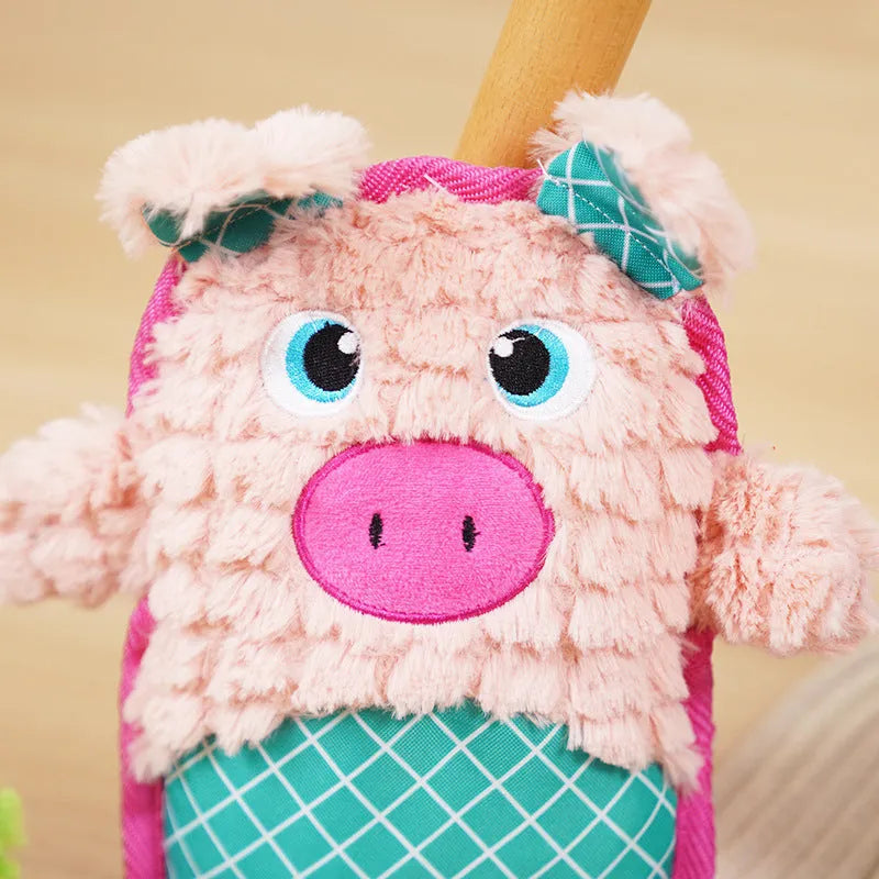 Blue, green, and pink dog toys with sound features and bite-resistant construction safe for molar teeth.