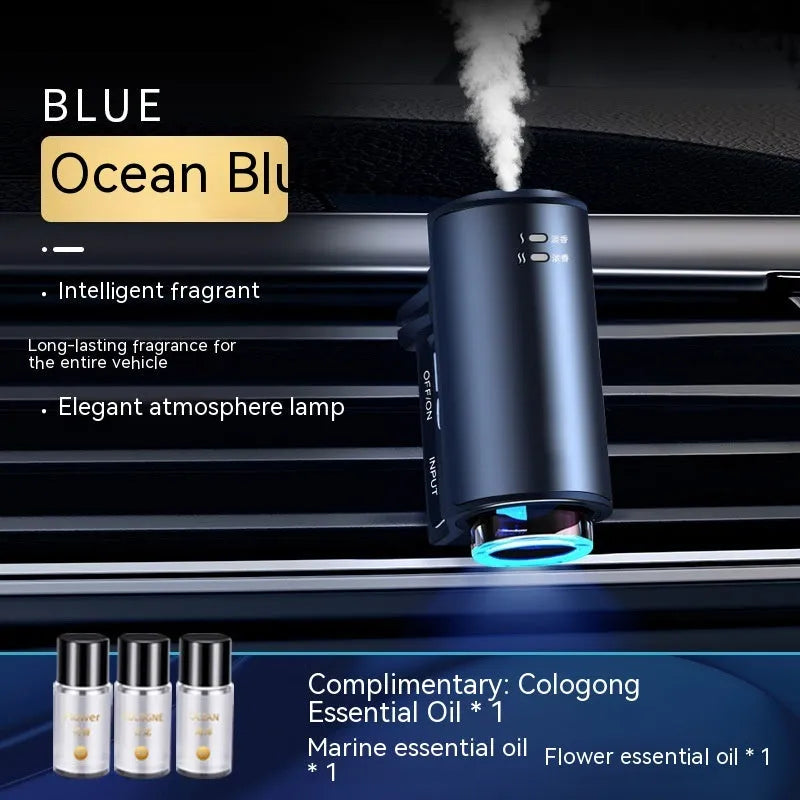 Smart car aroma diffuser clipped onto car air vent in obsidian black colour with essential oil bottles