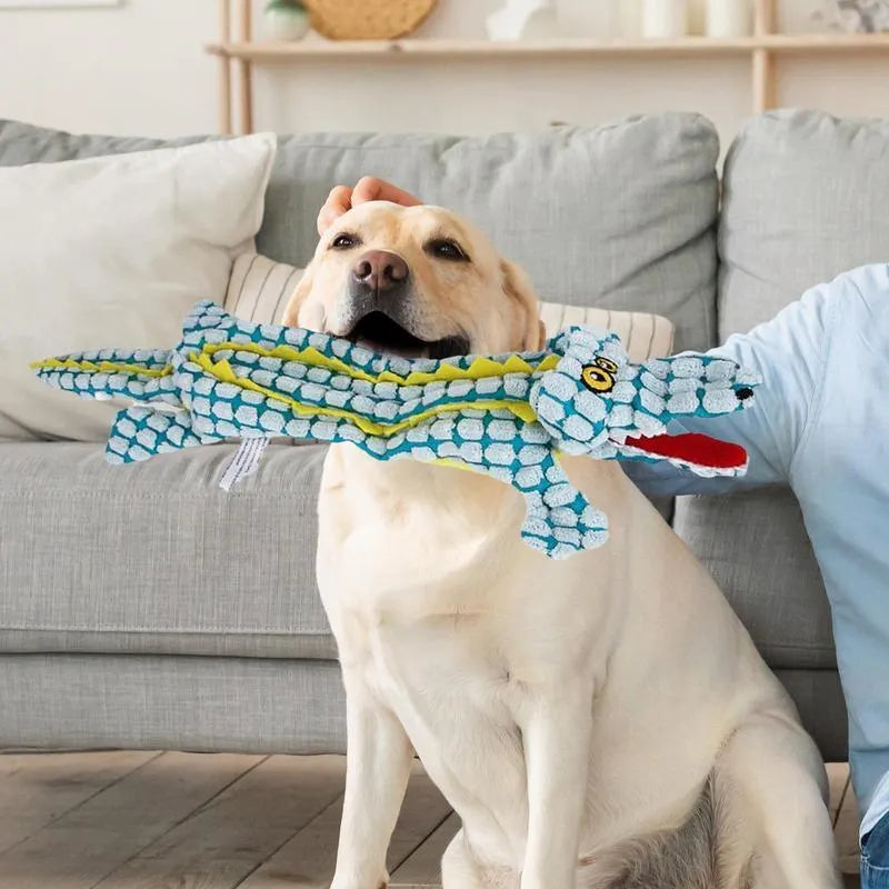 Blue corduroy crocodile-shaped squeaky dog toy shown next to size measurement