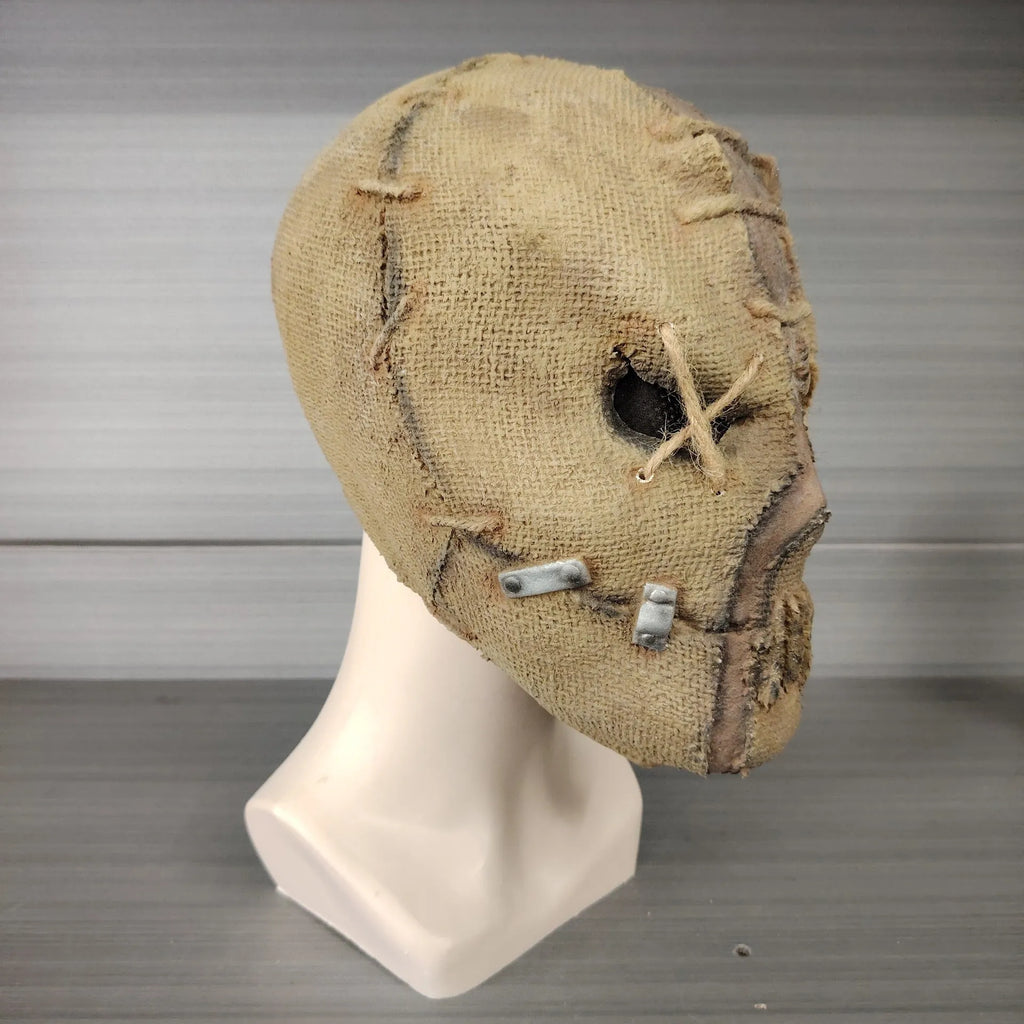 Latex Halloween mask featuring a detailed scar skull design, shown as a full head cover.