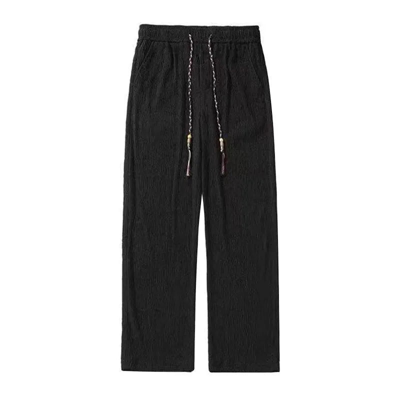Korean style men's summer pants in black with drooping texture and folding craft detailing
