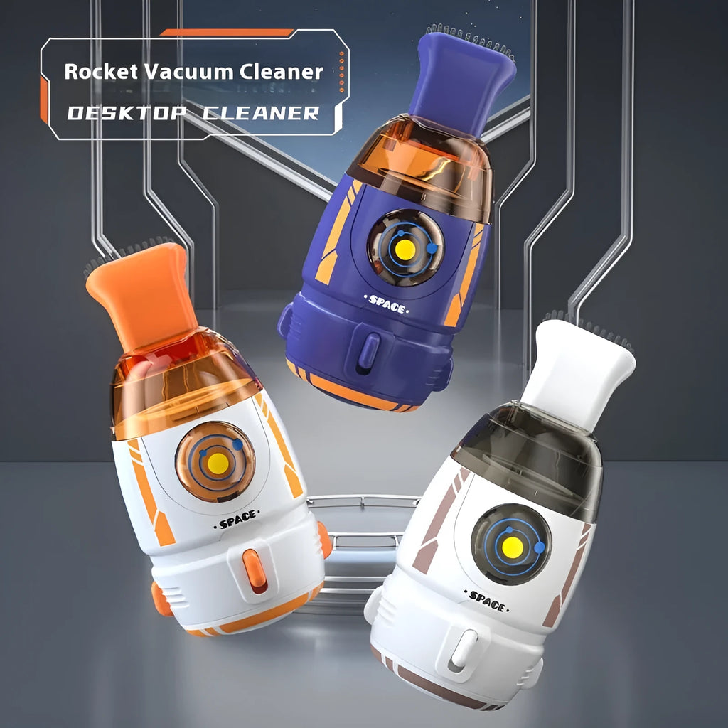 USB-powered handheld desktop vacuum cleaner in blue, placed next to a keyboard with crumbs.