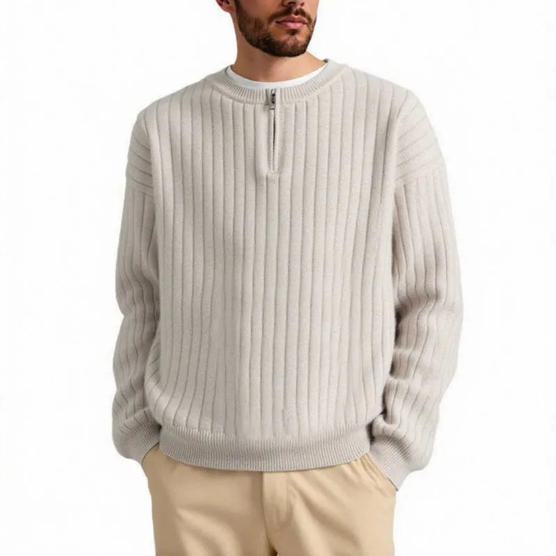 A grey men's textured knit half-zip pullover sweater on a hanger, showing the loose fit and long sleeves.