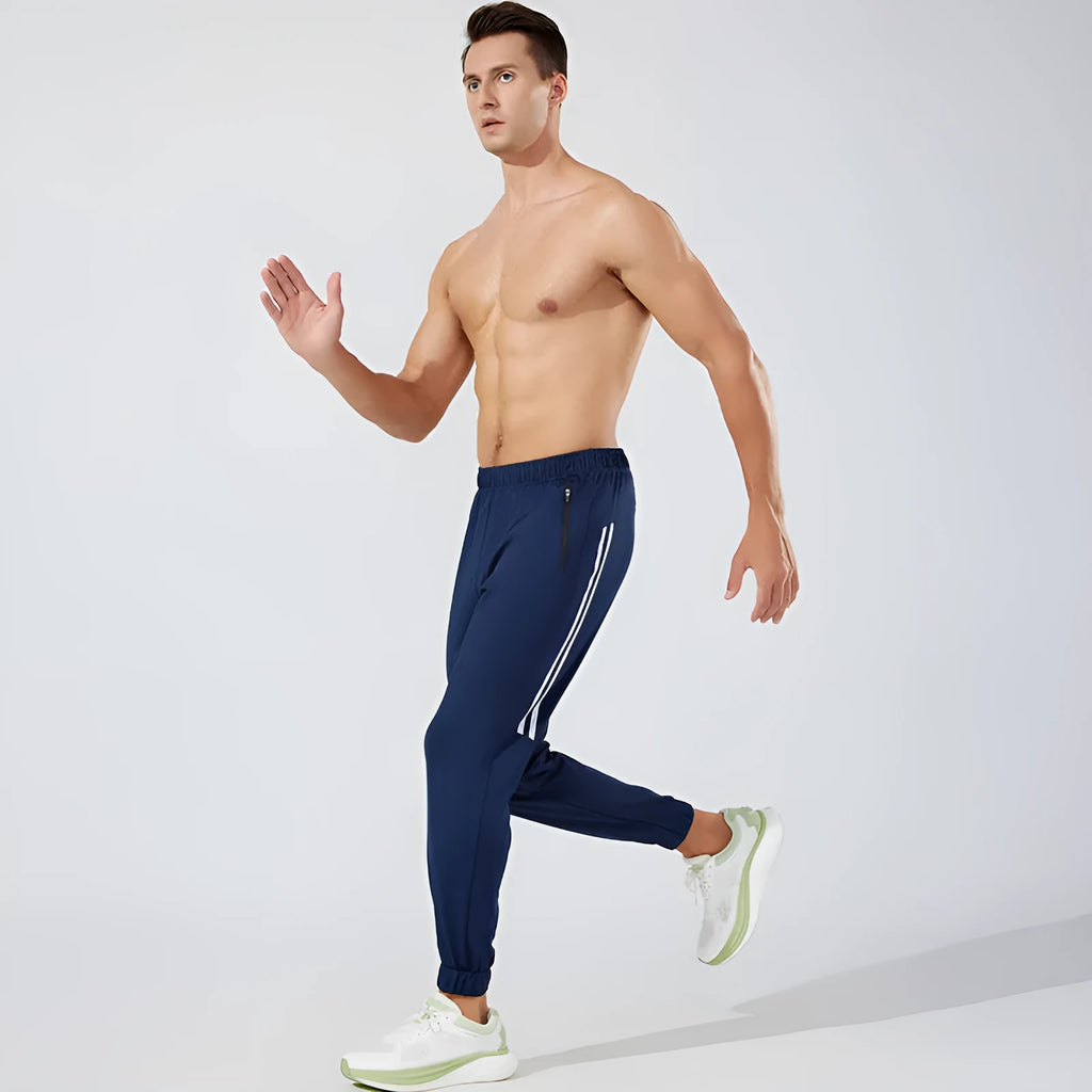 Black and navy blue men's polyester running trousers for exercise.