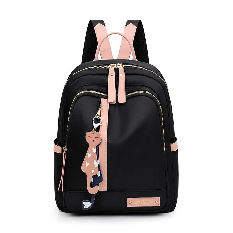 Women's black nylon backpack with anti-theft pockets and water-resistant finish.