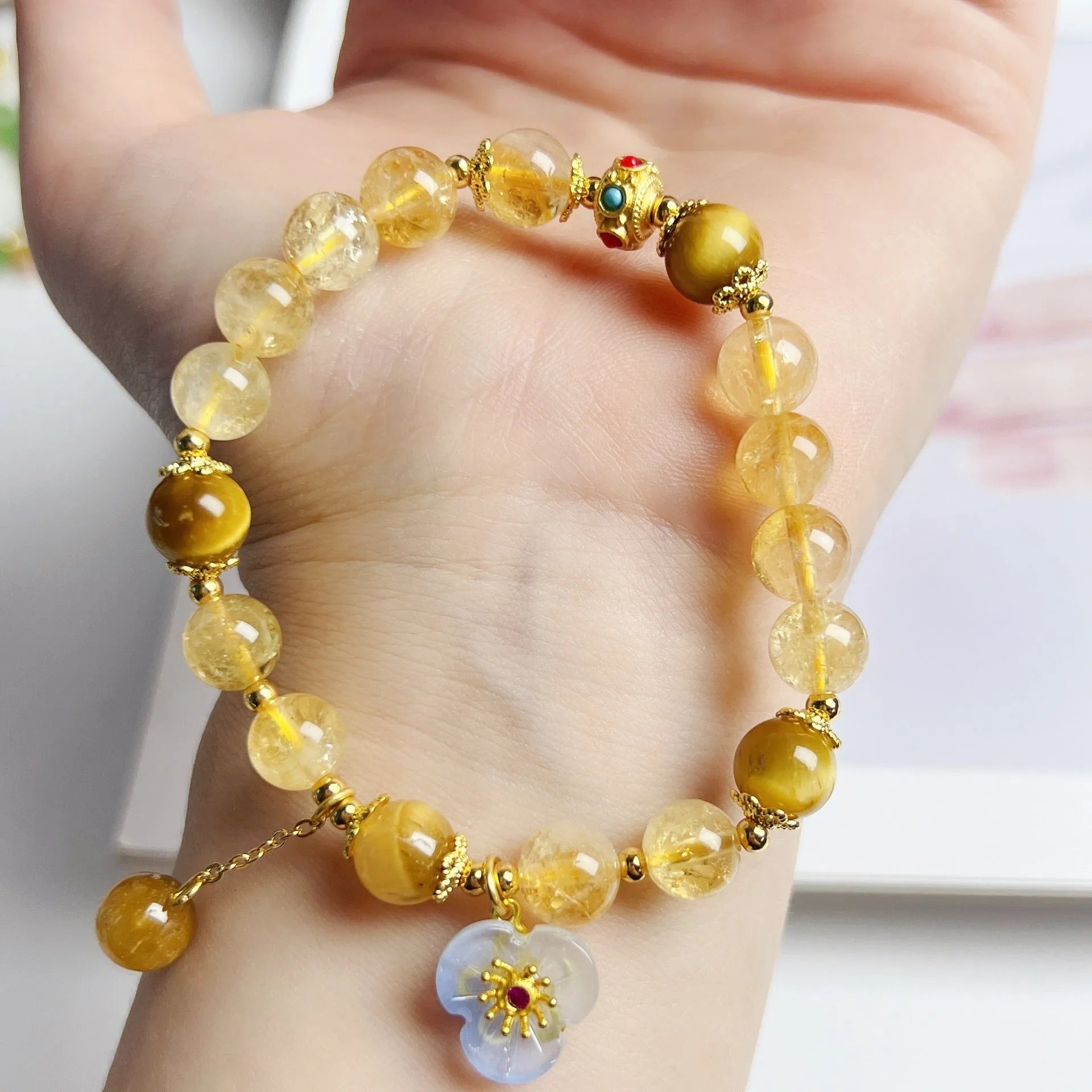 Women's citrine bracelet with floral tassel design, handcrafted crystal jewellery